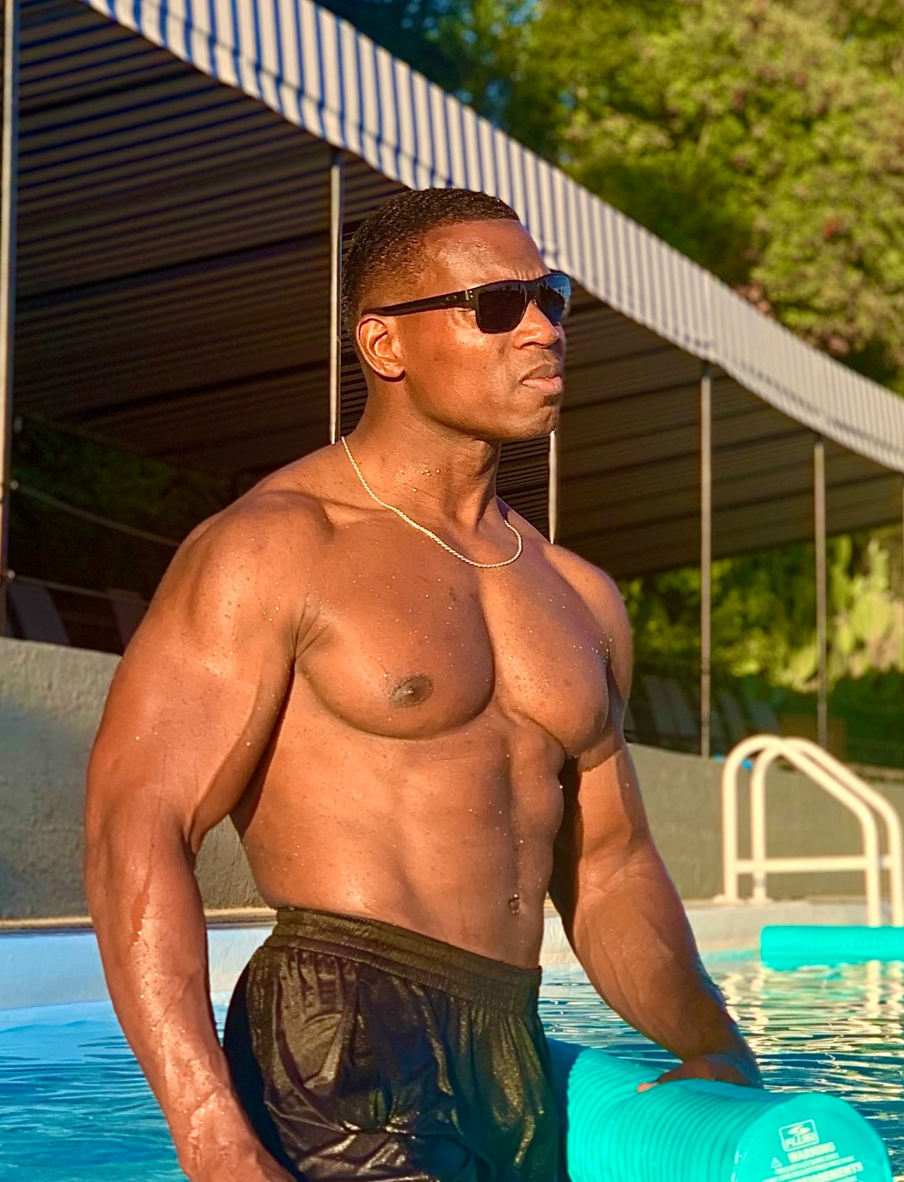 Lawrence Beamen poolside in sunlight