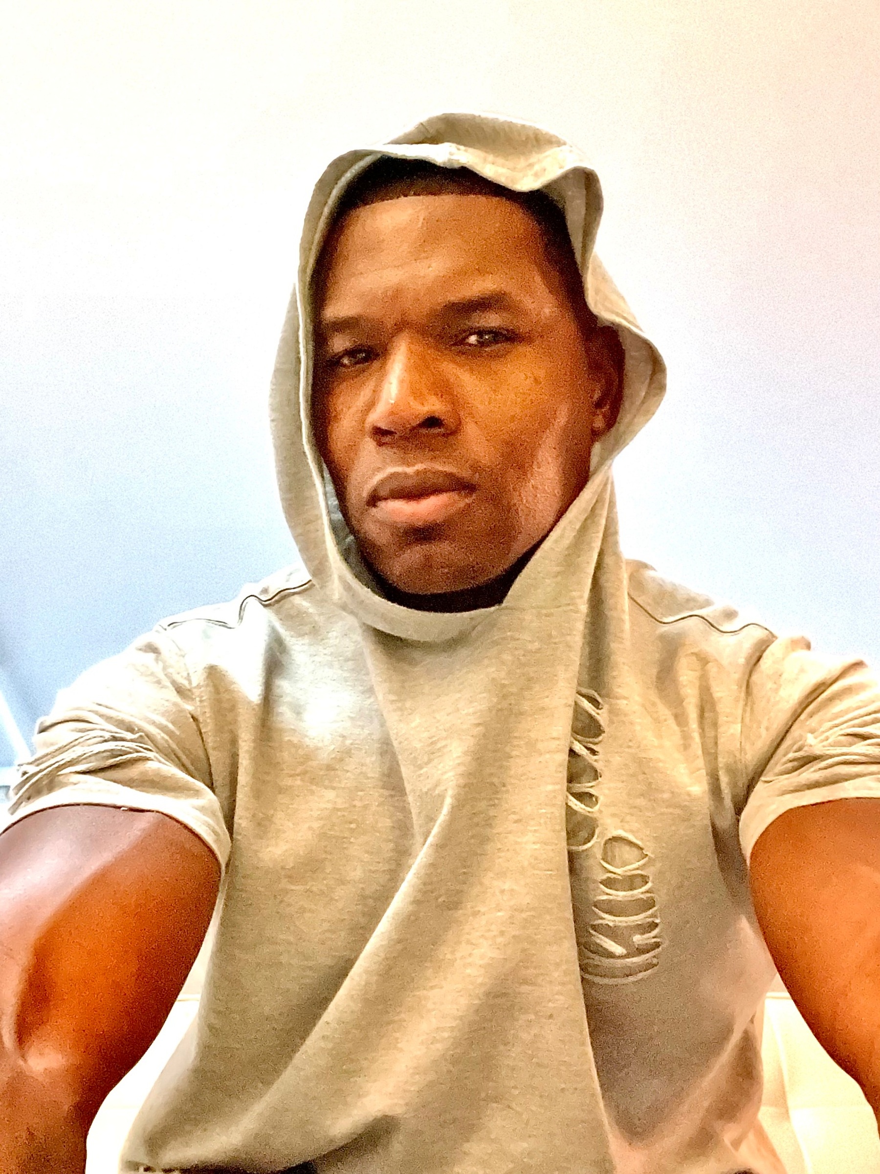 Close portrait of Lawrence Beamen in a hooded top