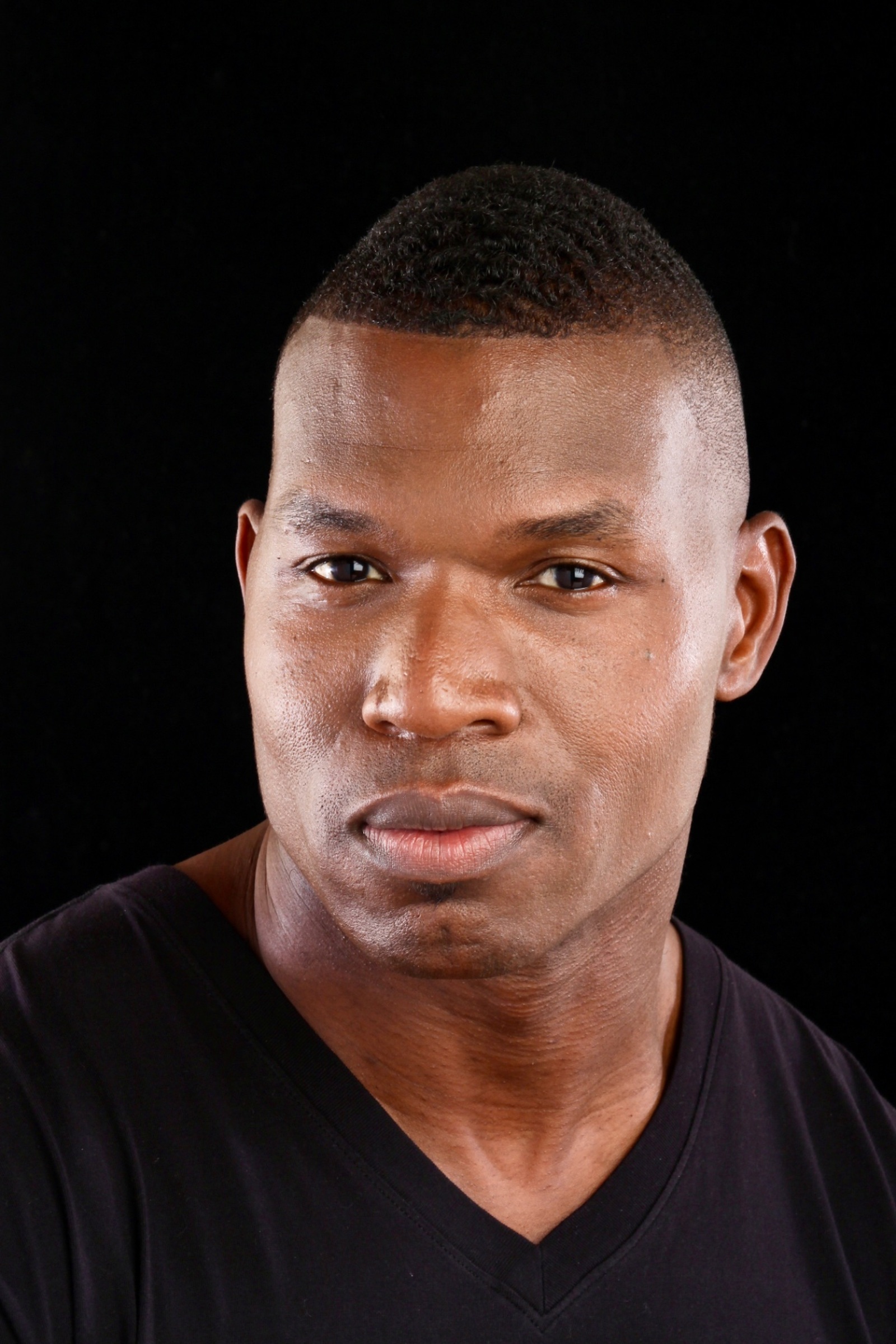Lawrence Beamen straight-on studio headshot on black