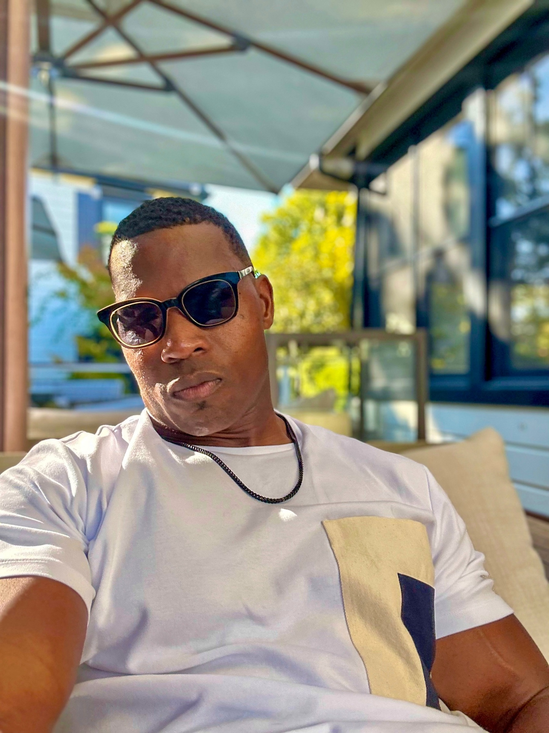 Lawrence Beamen relaxed in daylight wearing sunglasses